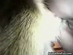 A married slut is fucking a horse's big black dick.